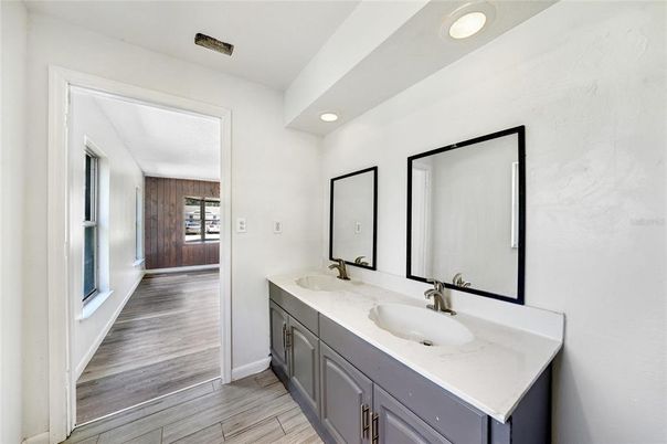 Bathroom, Dual Sink Vanities, Interior, Recessed Lighting, Wood Texture Flooring