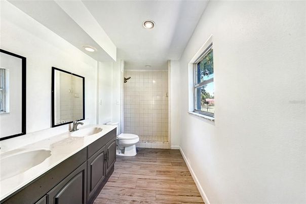 Bathroom, Dual Sink Vanities, Interior, Recessed Lighting, Wood Texture Flooring