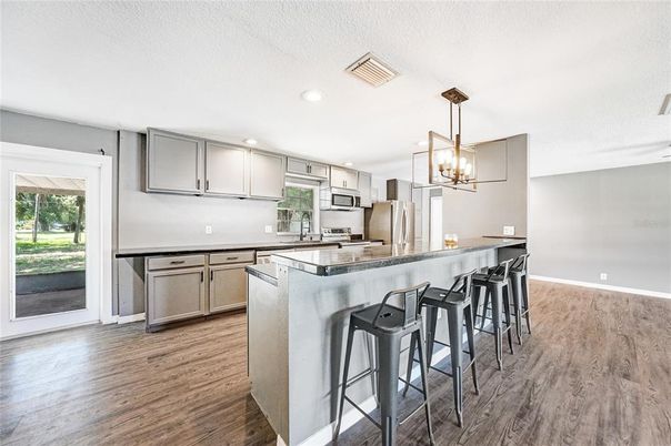 Interior, Kitchen, Pendant Lights, Recessed Lighting, Stainless Steel Appliances, Wood Texture Flooring