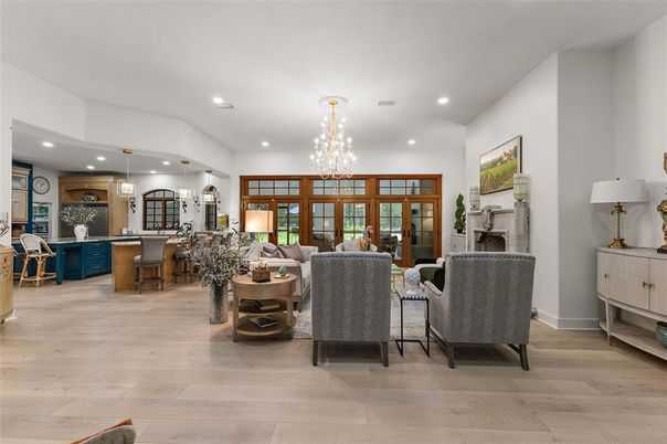 Chandelier, Dining room, Fireplace, Interior, Living room, Pendant Lights, Recessed Lighting, Wood Texture Flooring
