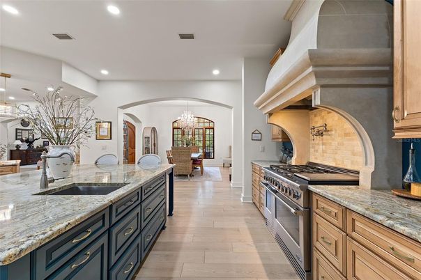 Chandelier, Dining room, Interior, Kitchen, Pendant Lights, Recessed Lighting, Stainless Steel Appliances, Wood Texture Flooring
