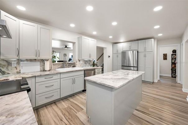 Interior, Kitchen, Recessed Lighting, Stainless Steel Appliances, Wood Texture Flooring