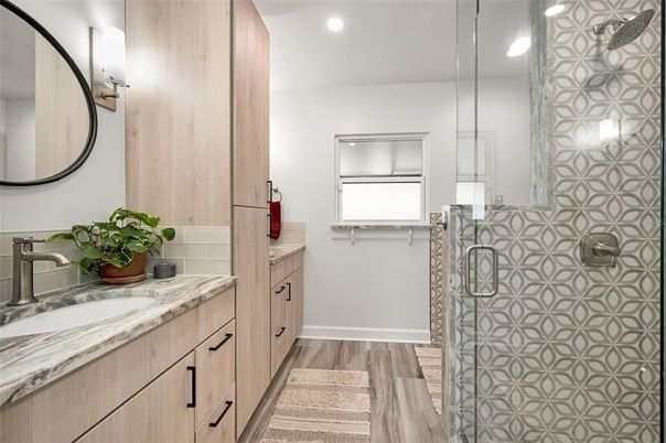 Bathroom, Dual Sink Vanities, Glass Shower, Interior, Recessed Lighting, Wood Texture Flooring