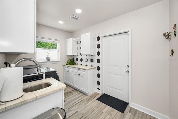 Interior, Kitchen, Recessed Lighting, Tile Countertops, Wood Texture Flooring