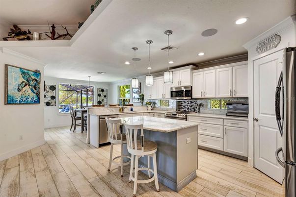 Dining room, Interior, Kitchen, Pendant Lights, Recessed Lighting, Stainless Steel Appliances, Wood Texture Flooring