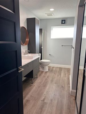 Bathroom, Dual Sink Vanities, Interior, Recessed Lighting, Wood Texture Flooring