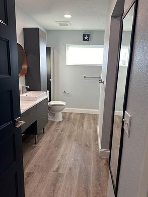 Bathroom, Dual Sink Vanities, Interior, Recessed Lighting, Wood Texture Flooring
