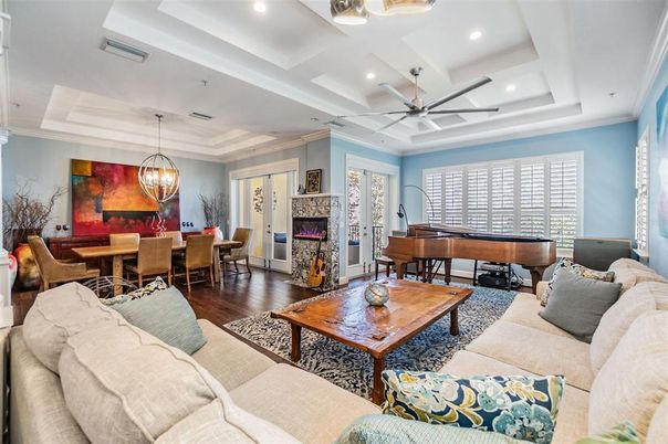 Chandelier, Dining room, Fireplace, Interior, Living room, Pendant Lights, Piano, Recessed Lighting, Wood Texture Flooring
