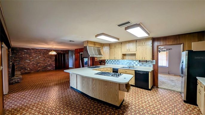Interior, Kitchen, Pendant Lights, Stainless Steel Appliances, Stone Walls