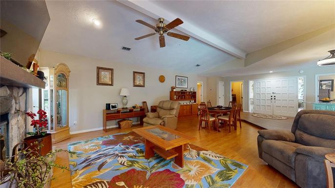 Dining room, Fireplace, Interior, Living room, Recessed Lighting, Wood Texture Flooring