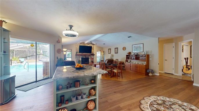 Dining room, Fireplace, Interior, Pool, Wood Texture Flooring