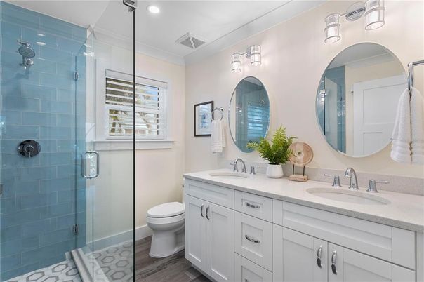 Bathroom, Dual Sink Vanities, Glass Shower, Interior, Recessed Lighting, Wood Texture Flooring