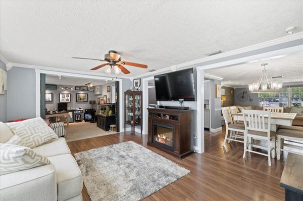 Chandelier, Dining room, Fireplace, Interior, Kitchen, Living room, Pendant Lights, Wood Texture Flooring