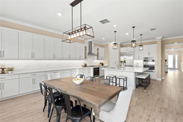 Dining room, Interior, Kitchen, Pendant Lights, Recessed Lighting, Stainless Steel Appliances, Wood Texture Flooring