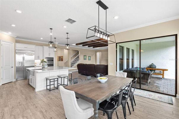 Dining room, Interior, Kitchen, Living room, Pendant Lights, Recessed Lighting, Stainless Steel Appliances, Wood Texture Flooring
