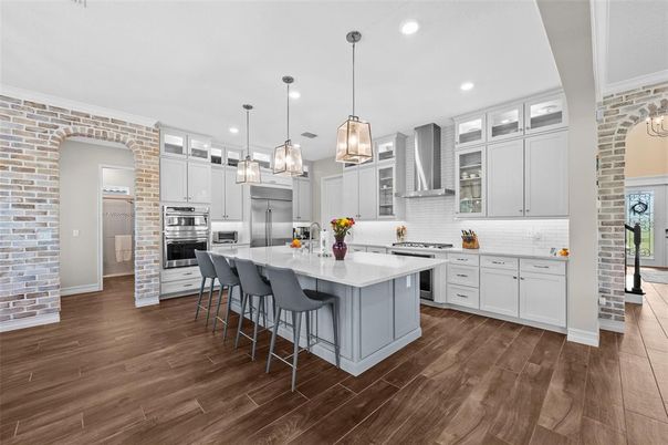 Interior, Kitchen, Pendant Lights, Recessed Lighting, Stainless Steel Appliances, Stone Walls, Wood Texture Flooring