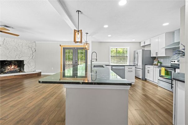 Fireplace, Interior, Kitchen, Pendant Lights, Recessed Lighting, Stainless Steel Appliances, Wood Texture Flooring