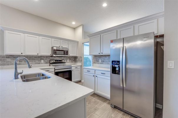Interior, Kitchen, Recessed Lighting, Stainless Steel Appliances, Wood Texture Flooring