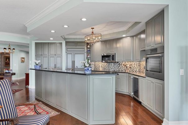 Chandelier, Interior, Kitchen, Recessed Lighting, Stainless Steel Appliances, Wood Texture Flooring
