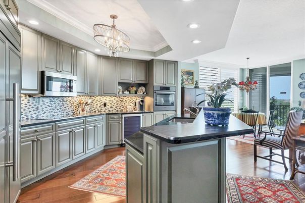 Chandelier, Dining room, Interior, Kitchen, Recessed Lighting, Stainless Steel Appliances, Wood Texture Flooring
