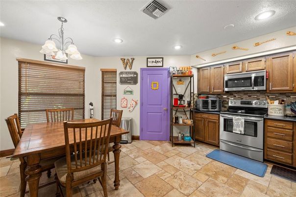 Chandelier, Dining room, Interior, Kitchen, Recessed Lighting, Stainless Steel Appliances