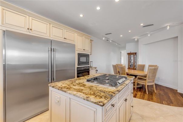 Dining room, Interior, Kitchen, Recessed Lighting, Stainless Steel Appliances, Wood Texture Flooring