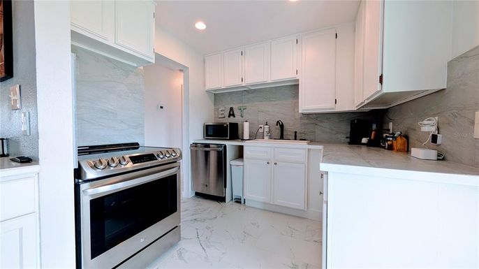 Interior, Kitchen, Marble, Marble Walls, Recessed Lighting, Stainless Steel Appliances