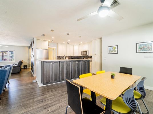 Dining room, Interior, Kitchen, Recessed Lighting, Stainless Steel Appliances, Wood Texture Flooring