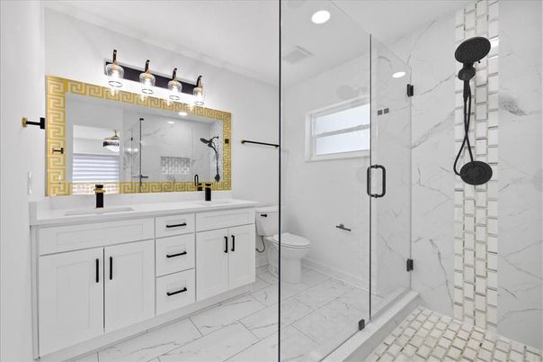 Bathroom, Dual Sink Vanities, Glass Shower, Interior, Marble, Marble Walls, Recessed Lighting