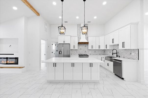 Fireplace, Interior, Kitchen, Marble, Pendant Lights, Recessed Lighting, Stainless Steel Appliances, Wooden Beams
