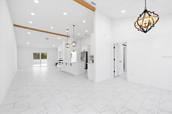 Chandelier, Empty room, Interior, Kitchen, Marble, Pendant Lights, Recessed Lighting, Stainless Steel Appliances, Wooden Beams