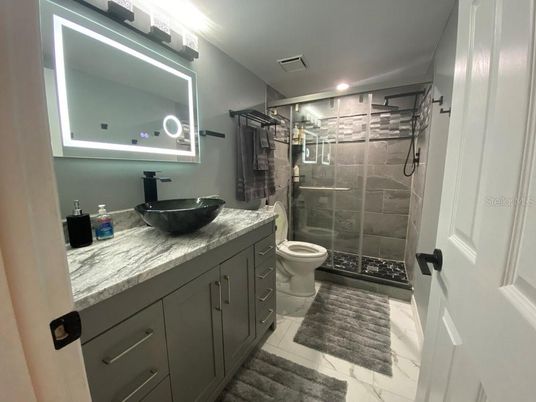 Bathroom, Dual Sink Vanities, Glass Shower, Interior, Marble, Recessed Lighting
