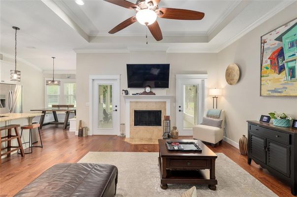 Dining room, Fireplace, Interior, Living room, Pendant Lights, Recessed Lighting, Wood Texture Flooring