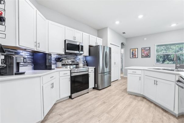 Interior, Kitchen, Recessed Lighting, Stainless Steel Appliances, Wood Texture Flooring