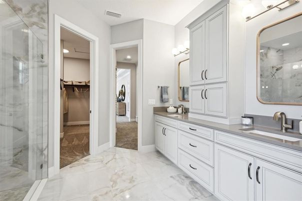 Bathroom, Dual Sink Vanities, Glass Shower, Interior, Marble, Recessed Lighting, Walk-in Closets