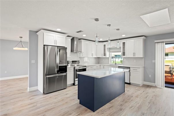 Interior, Kitchen, Pendant Lights, Recessed Lighting, Stainless Steel Appliances, Wood Texture Flooring