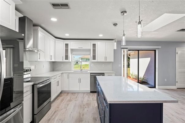 Interior, Kitchen, Pendant Lights, Recessed Lighting, Stainless Steel Appliances, Wood Texture Flooring