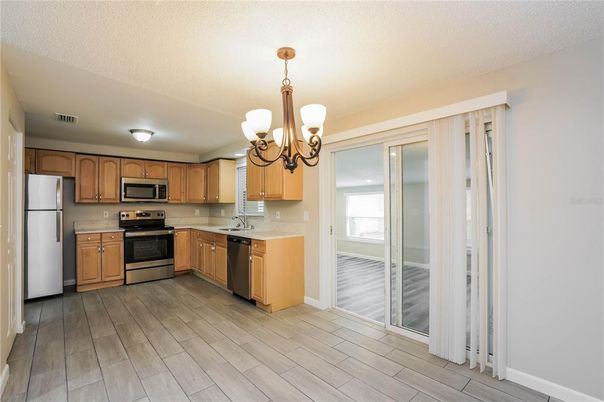 Chandelier, Interior, Kitchen, Stainless Steel Appliances, Wood Texture Flooring