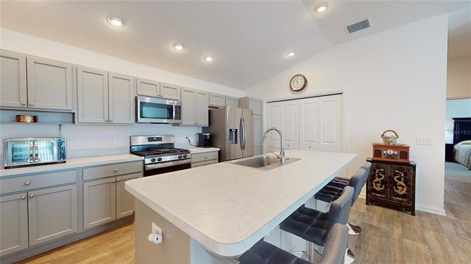 Interior, Kitchen, Recessed Lighting, Stainless Steel Appliances, Wood Texture Flooring
