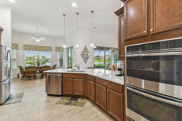 Dining room, Interior, Kitchen, Pendant Lights, Recessed Lighting, Stainless Steel Appliances, Wood Texture Flooring