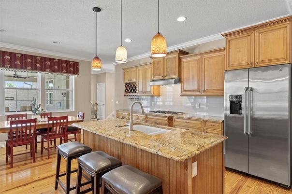 Dining room, Interior, Kitchen, Pendant Lights, Recessed Lighting, Stainless Steel Appliances, Wood Texture Flooring