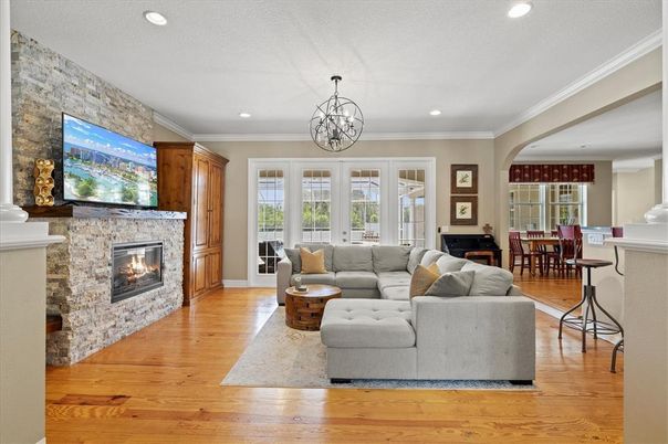 Chandelier, Dining room, Fireplace, Interior, Living room, Recessed Lighting, Stone Walls, Wood Texture Flooring