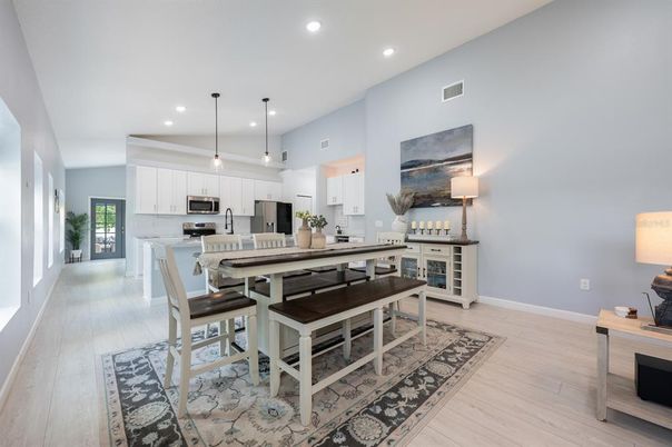Dining room, Interior, Kitchen, Pendant Lights, Recessed Lighting, Stainless Steel Appliances, Wood Texture Flooring