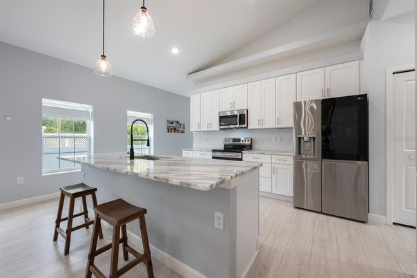 Interior, Kitchen, Pendant Lights, Recessed Lighting, Stainless Steel Appliances, Wood Texture Flooring