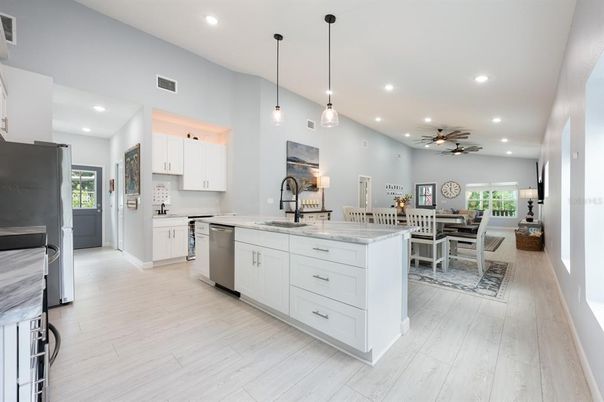 Dining room, Interior, Kitchen, Pendant Lights, Recessed Lighting, Stainless Steel Appliances, Wood Texture Flooring
