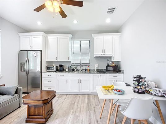 Dining room, Interior, Kitchen, Recessed Lighting, Stainless Steel Appliances, Wood Texture Flooring