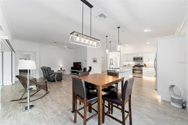 Dining room, Interior, Kitchen, Living room, Pendant Lights, Recessed Lighting, Stainless Steel Appliances, Wood Texture Flooring