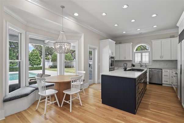 Chandelier, Dining room, Interior, Kitchen, Pendant Lights, Recessed Lighting, Stainless Steel Appliances, Wood Texture Flooring