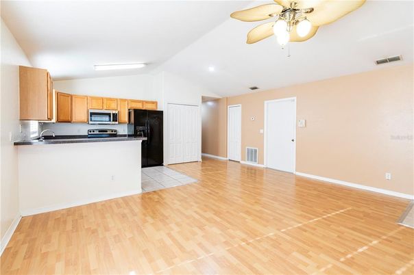 Empty room, Interior, Kitchen, Stainless Steel Appliances, Wood Texture Flooring