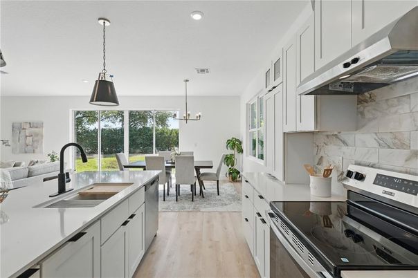 Dining room, Interior, Kitchen, Pendant Lights, Recessed Lighting, Stainless Steel Appliances, Wood Texture Flooring